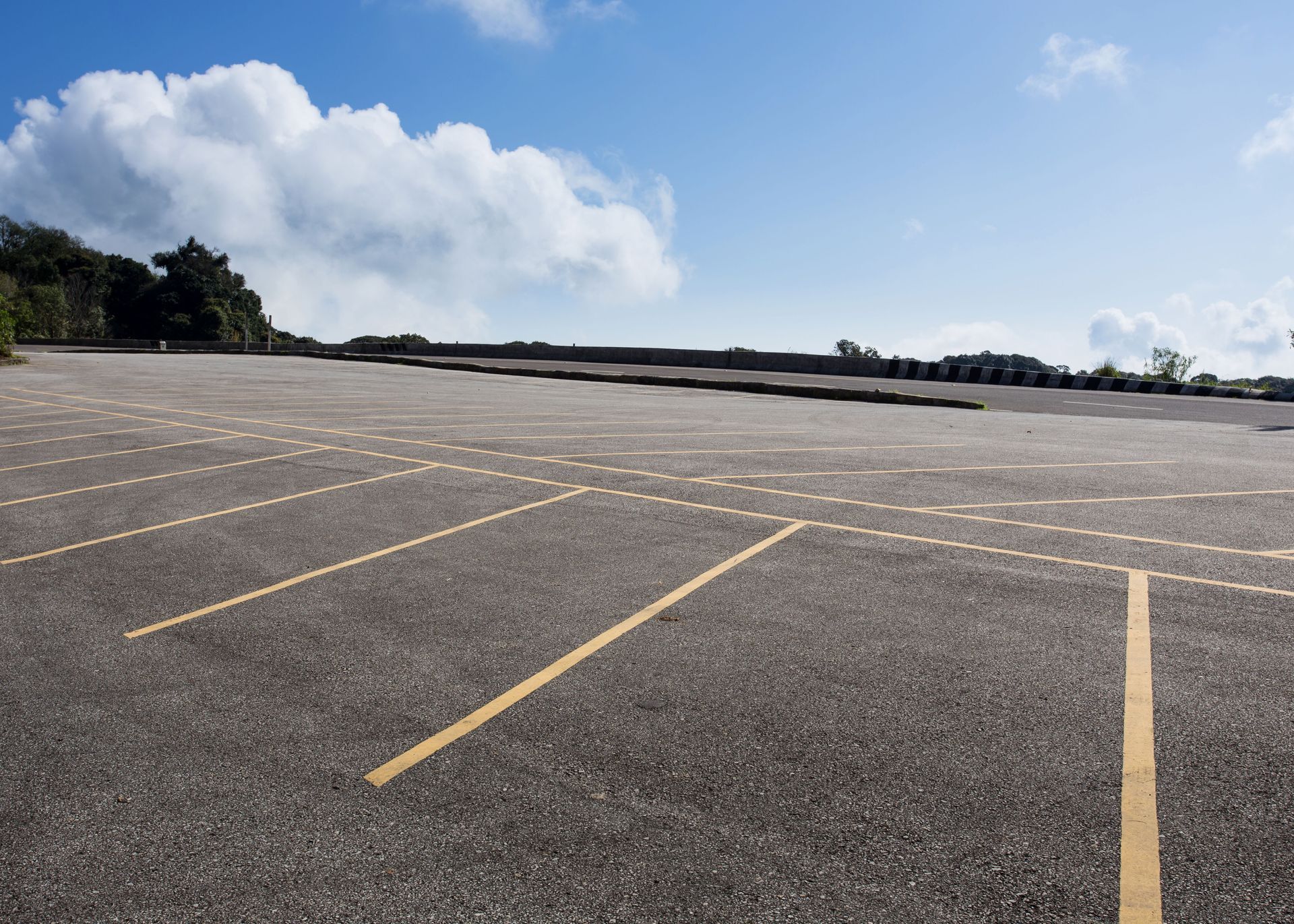 Empty parking lot with fresh yellow striping