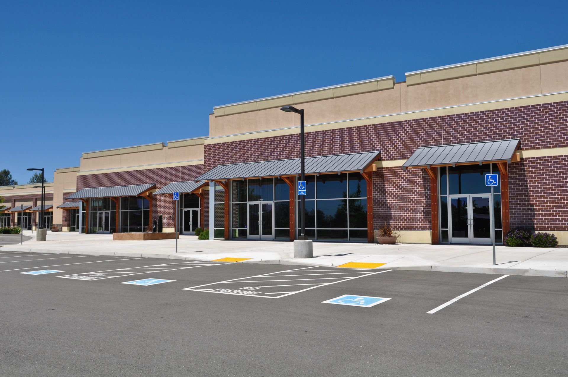 Strip mall with accessible parking signage